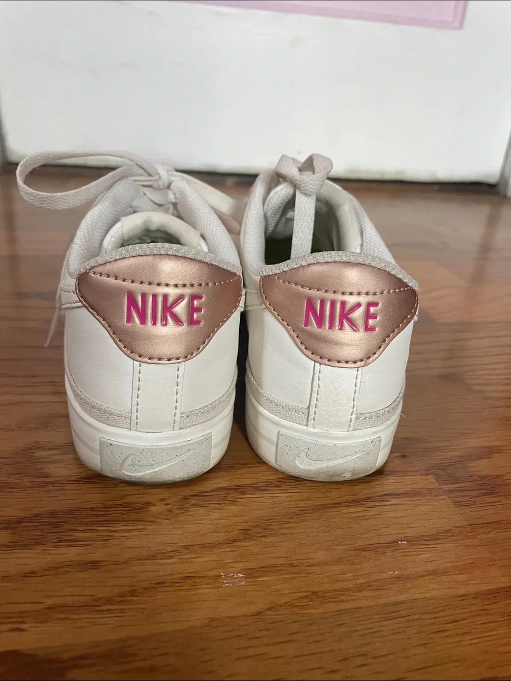 Nike Women’s White Low-Top Sneakers with Blush Heel